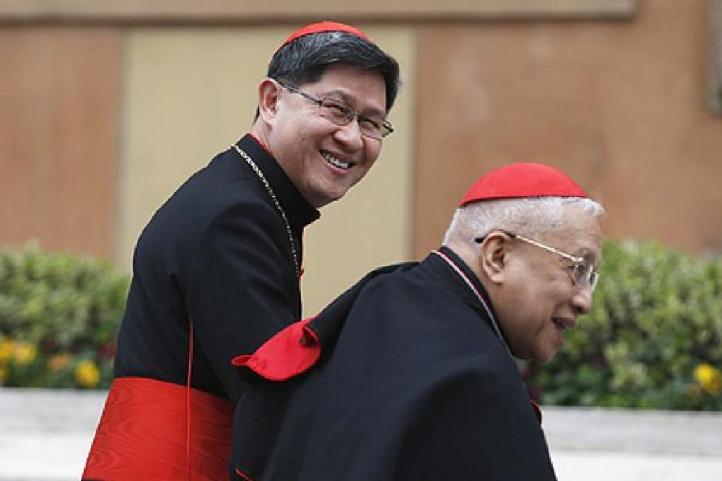 Filipino Cardinal Luis Antonio Tagle (left) and his compatriot Cardinal Ricardo Vidal arrive for a meeting at the Synod Hall in the Vatican on Wednesday. Photo: Reuters