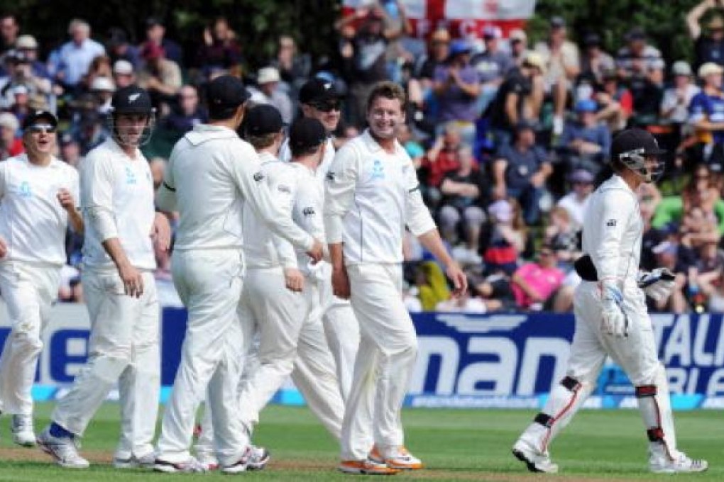 New Zealand's Bruce Martin (centre) celebrates on the second day of the 1st international cricket test in Dunedin, New Zealand, on Thursday. Photo: AP