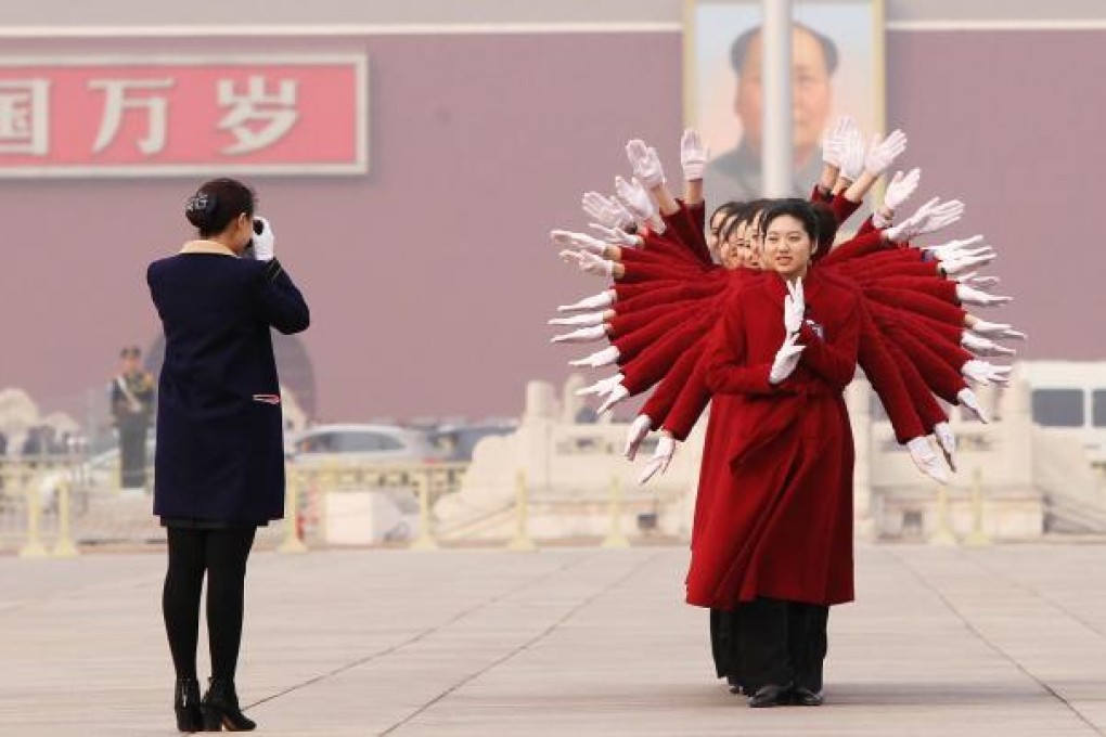 Hotel employees in Tiananmen Square in Beijing. Photo: Simon Song