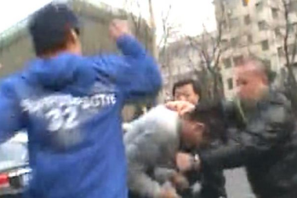 TVB cameraman Tam Wing-man is attacked in Beijing yesterday.