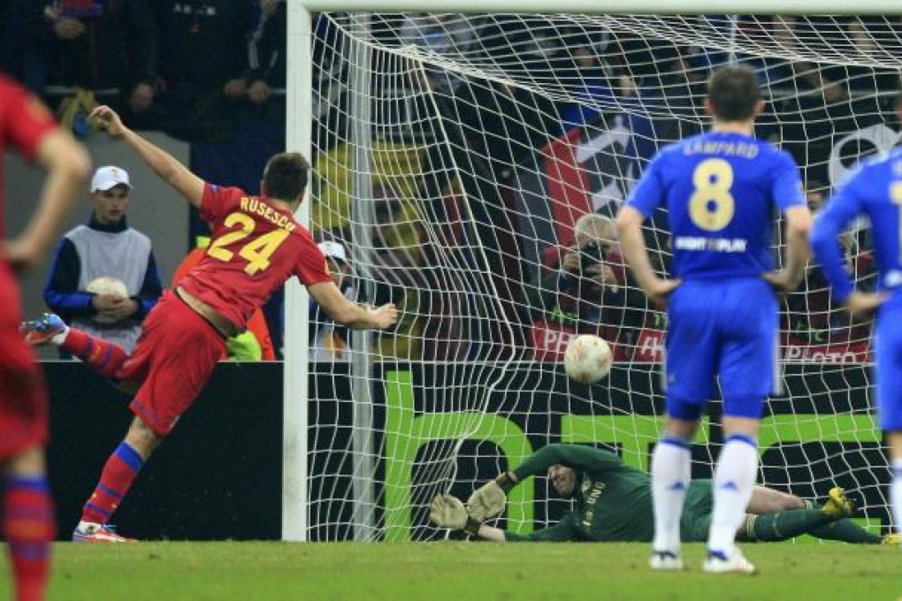 Raul Rusescu scores from the spot as Chelsea slumped to a Europa League defeat at Steaua Bucharest on Thursday night. Photo: Reuters