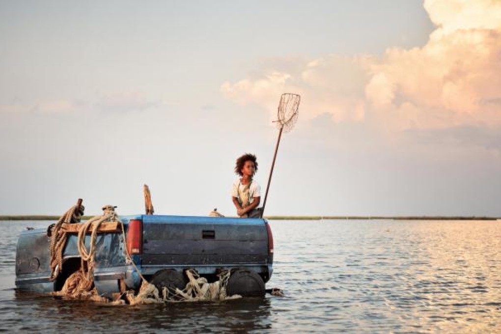 Hushpuppy, played by Quvenzhane Wallis, navigates through a bleak Louisiana landscape in Beasts of the Southern Wild, by director Benh Zeitlin. Photos: Jess Pinkham