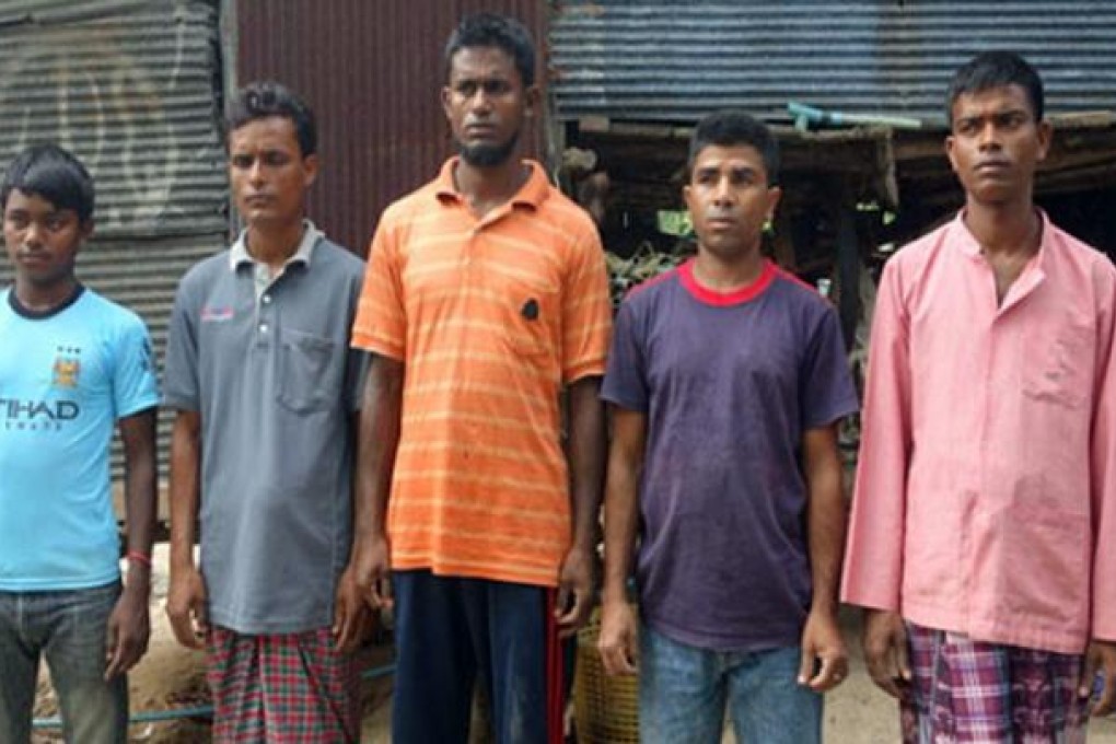 Rohingyan men who managed to swim to take refuge in a Muslim village in Phuket. Photo: Phuketwan