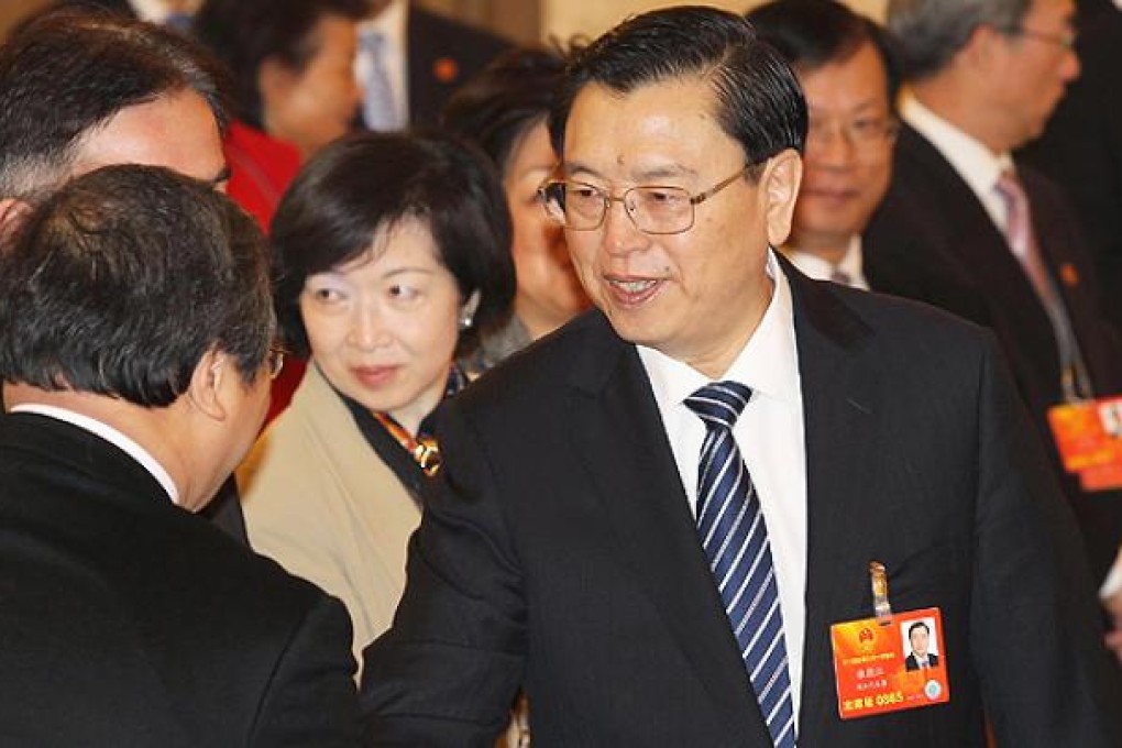 Zhang Dejiang shakes hands with Hong Kong NPC delegates at the Great Hall of the People in Beijing yesterday. Photo: Simon Song
