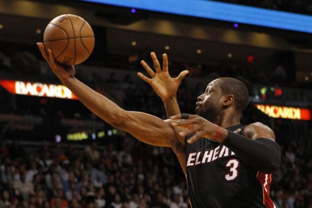 Miami's Dwyane Wade scores against Orlando. Photo: Reuters