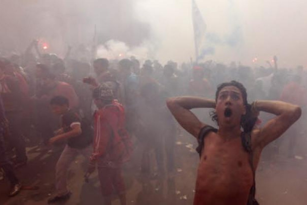 Al-Ahly fans celebrate and shout slogans after hearing final verdict of Port Said massacre in Cairo. Photo: Reuters