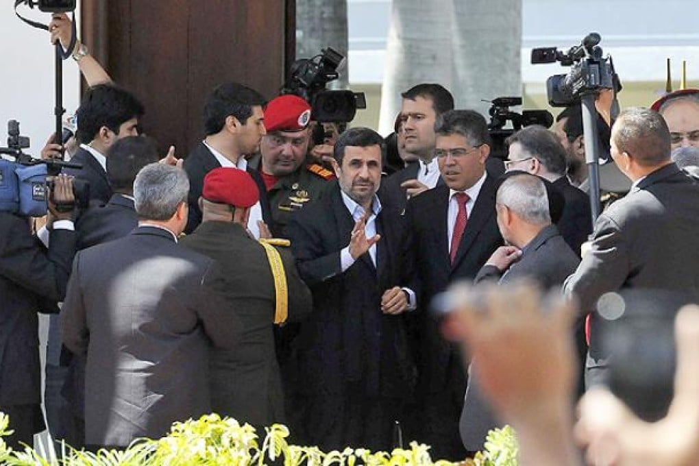 Iranian President Mahmoud Ahmadinejad attends the funeral of late Venezuelan President Hugo Chavez. Photo: AFP