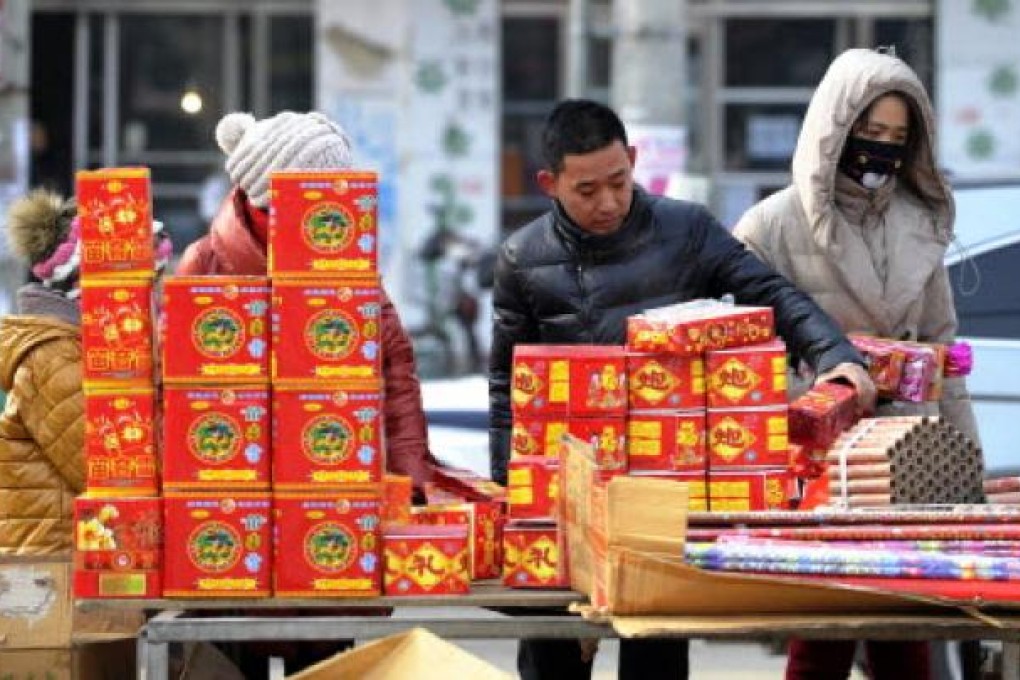 Chinese shoppers browse through fireworks for the celebration of the Chinese New Year in Liaoning province. Photo: AFP