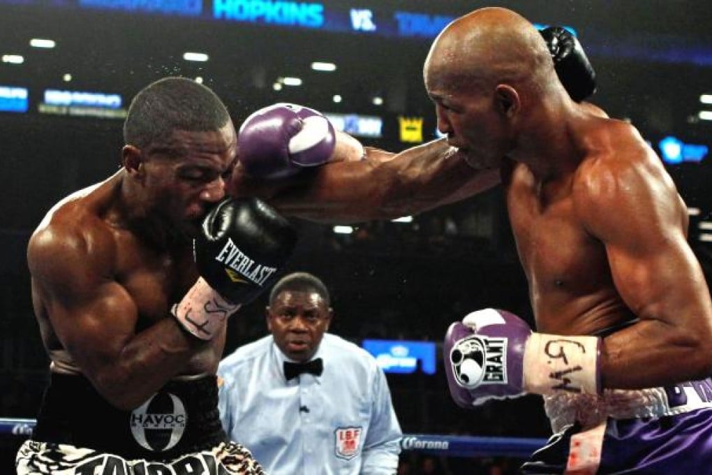 Bernard Hopkins (right) connects with a right hook against Tavoris Cloud. Photo: Reuters
