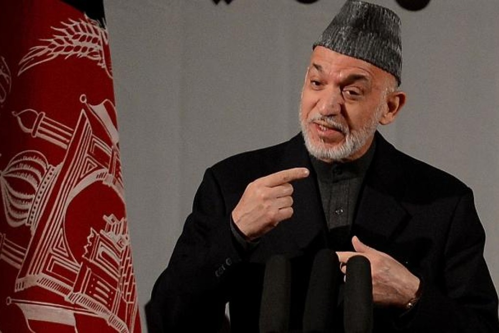 Afghan President Hamid Karzai speaks at a gathering of women to mark International Women's Day, in Kabul. Photo: AFP