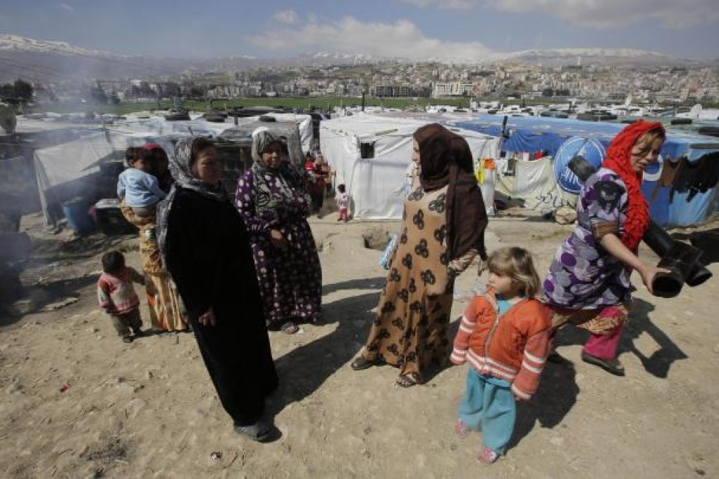 Syrian families at a refugee camp in Lebanon. Photo: AFP