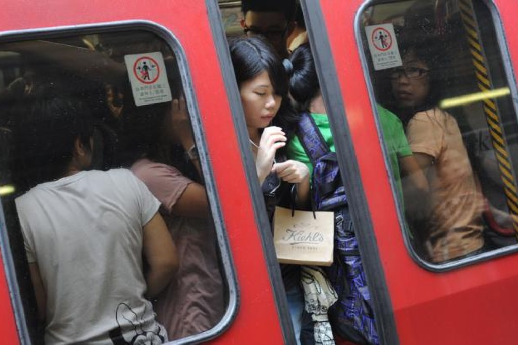 Some people insist on trying to squeeze on board a full compartment while the train doors are closing.