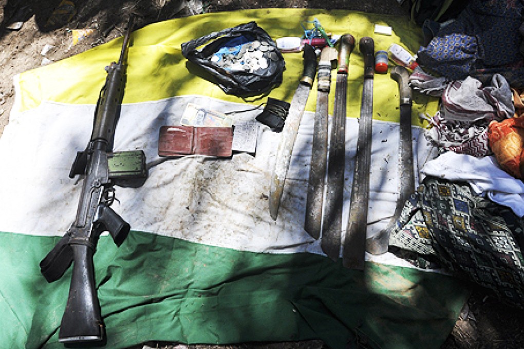 Weapons used by Filipino gunmen found in Tanduo village in Sabah, Malaysia. Photo: AFP