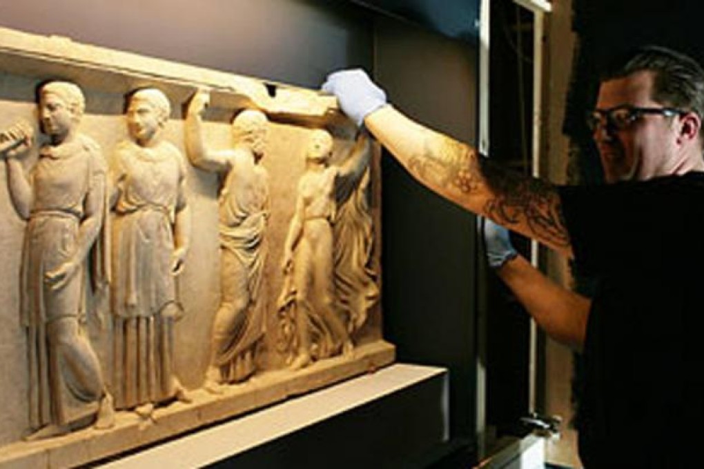 Two reliefs from a house in Herculaneum. Photo: Martin Godwin