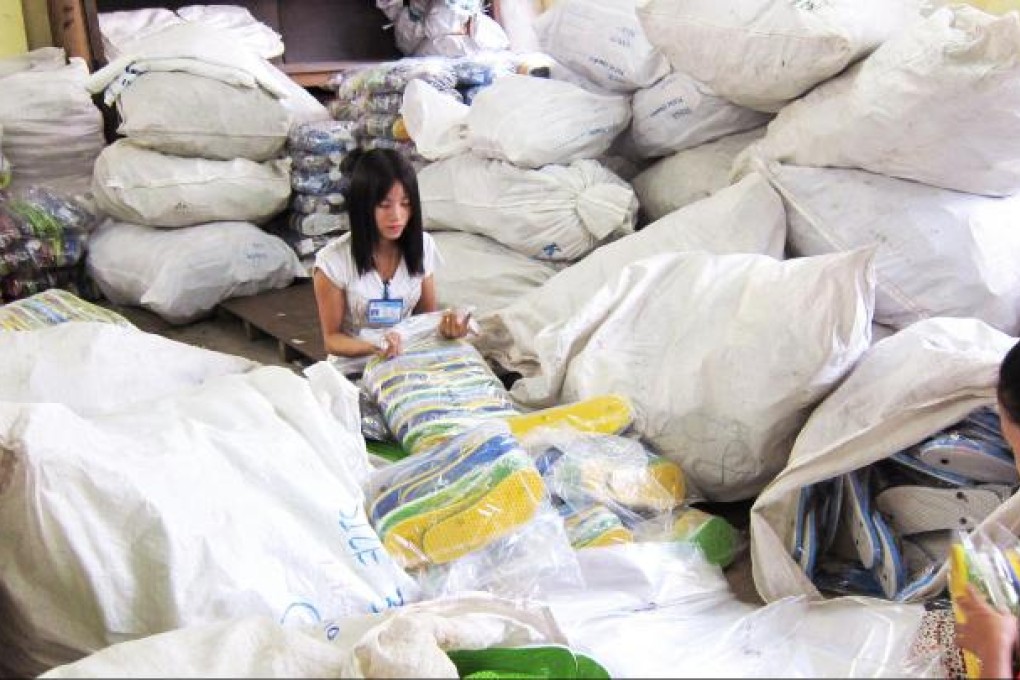 Reva is starting to sell flip-flop sandals to Italy since the sanctions from the EU have been suspended. The firm produces 12,000 sandals a day. Photo: Charlotte So