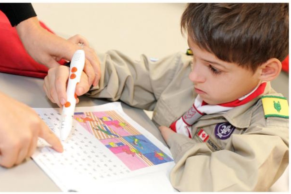 A Year Three student uses the pen during a Putonghua class at Canadian International School. Photo: Paul Yeung