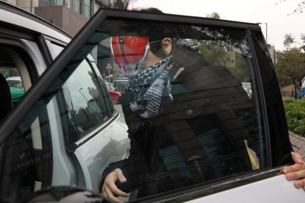 A masked Vincent Chan Cheuk-yin appears at Fanling Court to face his charge of attempted criminal damage. Photo: Felix Wong