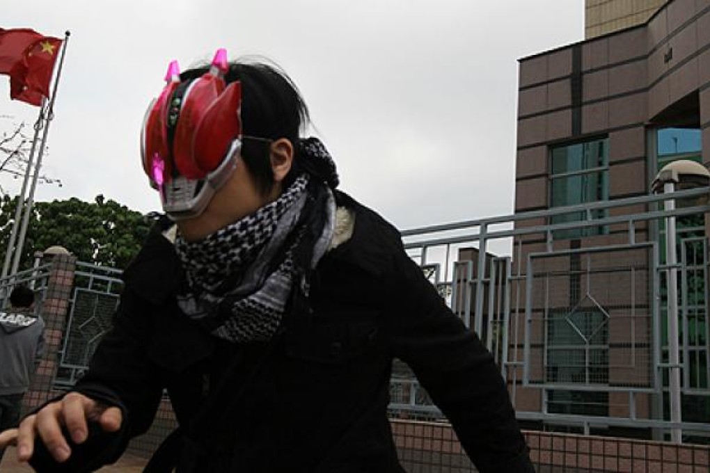 Vincent Chan Cheuk-yin leaves Fan Ling Magistrates Court after being sentenced for crashing a university website running a mock chief executive poll. Photo: Felix Wong