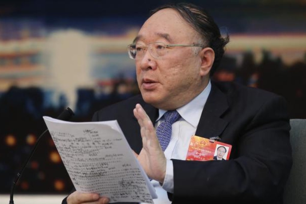 Chongqing Mayor Huang Qifan speaks at the Chongqing delegation's group discussion during the National People's Congress. Photo: Reuters