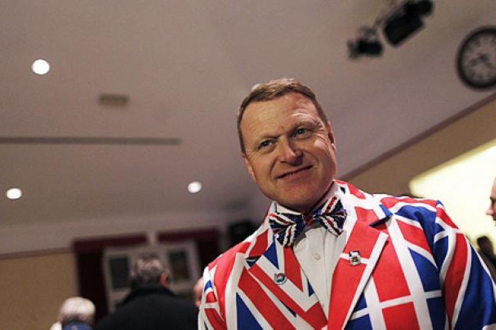 Andrew Brown Lee, a Falklands islander, wears a Union Jack suit as he attends a vote count on Monday. Photo: Reuters