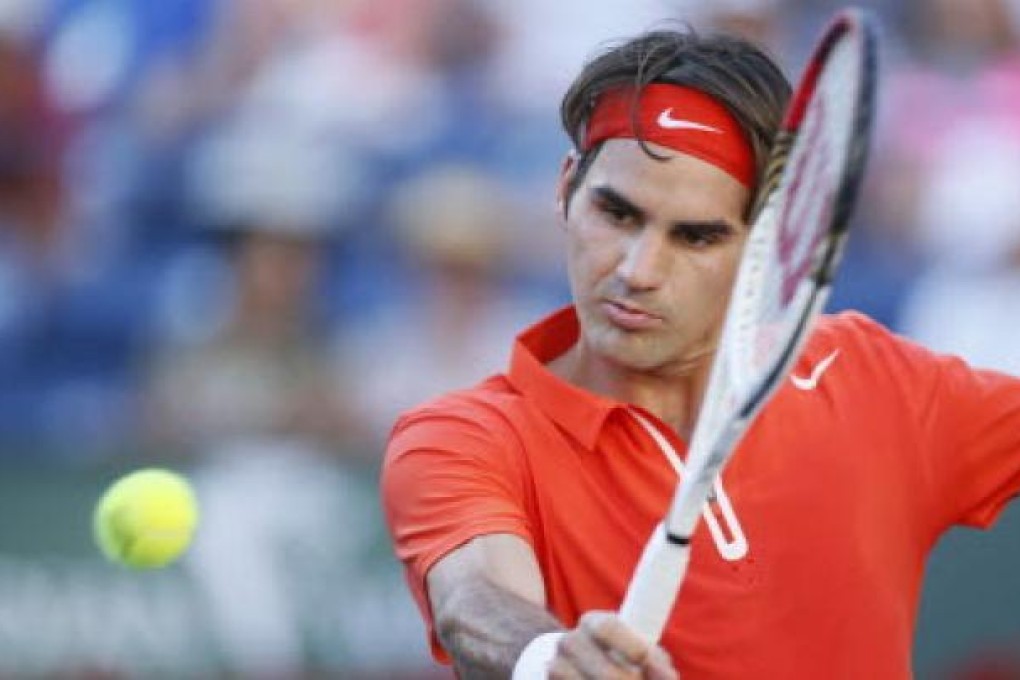 Roger Federer of Switzerland returns a shot against Ivan Dodig of Croatia during their match at the BNP Paribas Open ATP tennis tournament in Indian Wells, California. Photo: Reuters