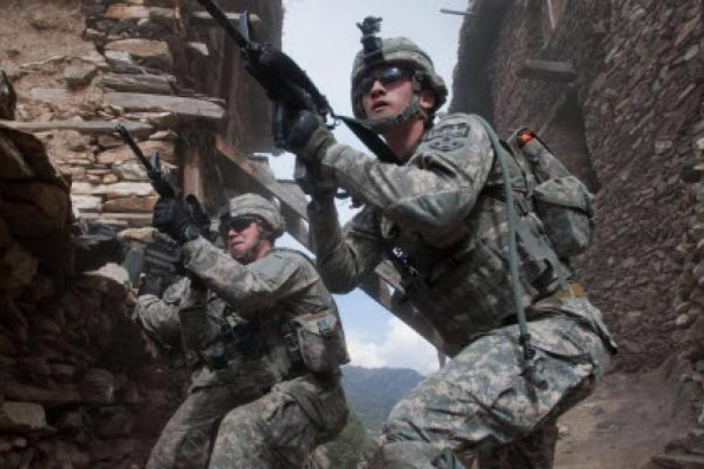US troops on patrol in Afghanistan. Five Nato troops have died in a helicopter crash in the troubled region. Photo: AP