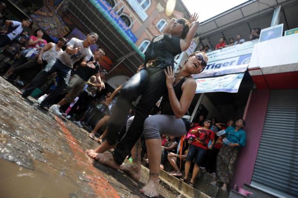 Gay Yangon residents celebrate during the first day of the Thingyan water festival in April of 2011. Photo: AFP