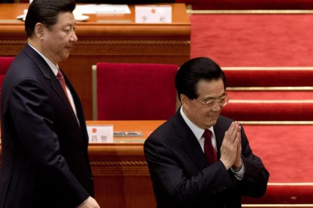 Outgoing President Hu Jintao (right) arrives at the NPC session with his successor, Xi Jinping. Photo: AP