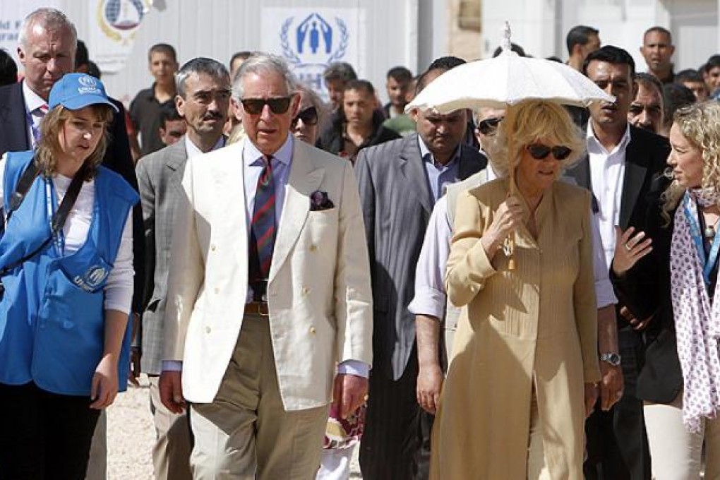 Britain's Prince Charles and his wife Camilla, Duchess of Cornwall, visit the King Abdullah Park for Syrian refugees in Ramtha, north of Amman, Jordan. Photo: Reuters