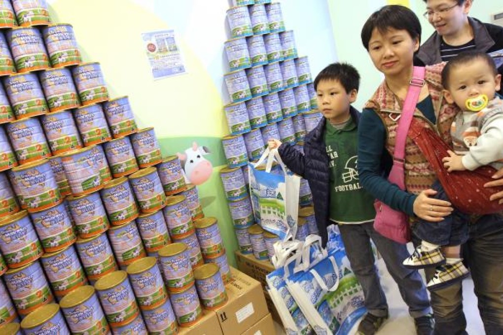 New restrictions limit travellers from taking more than two cans of milk powder out of Hong Kong. Photo: David Wong