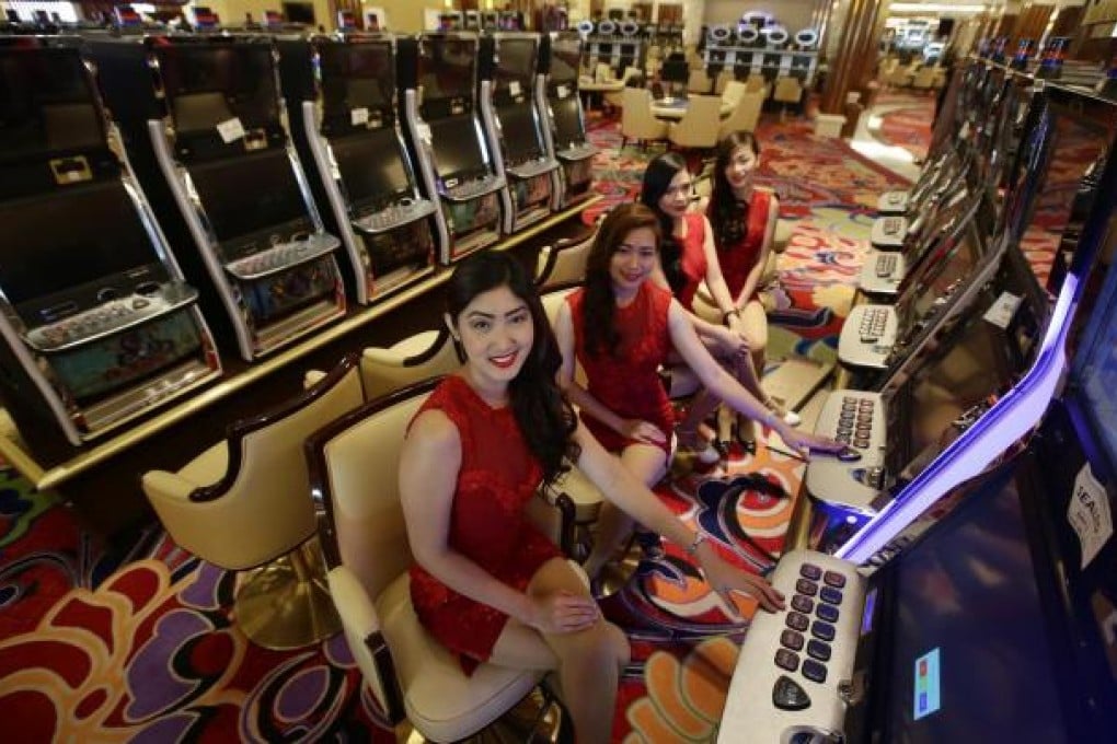 Casino "guest officers" inside the Solaire Resort and Casino, which opens today in Manila. Photo: EPA