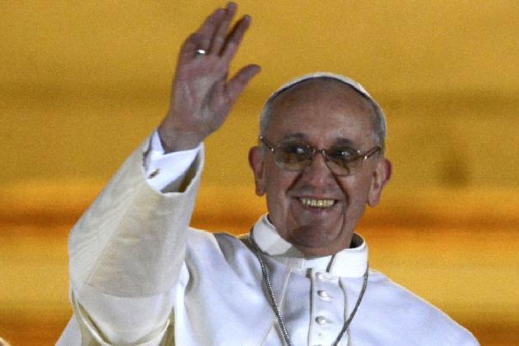 Pope Francis appears on the balcony of St Peter's Basilica after being elected by the conclave of cardinals. He is the first pope from the Jesuit order and the first from Latin America. Photo: Reuters