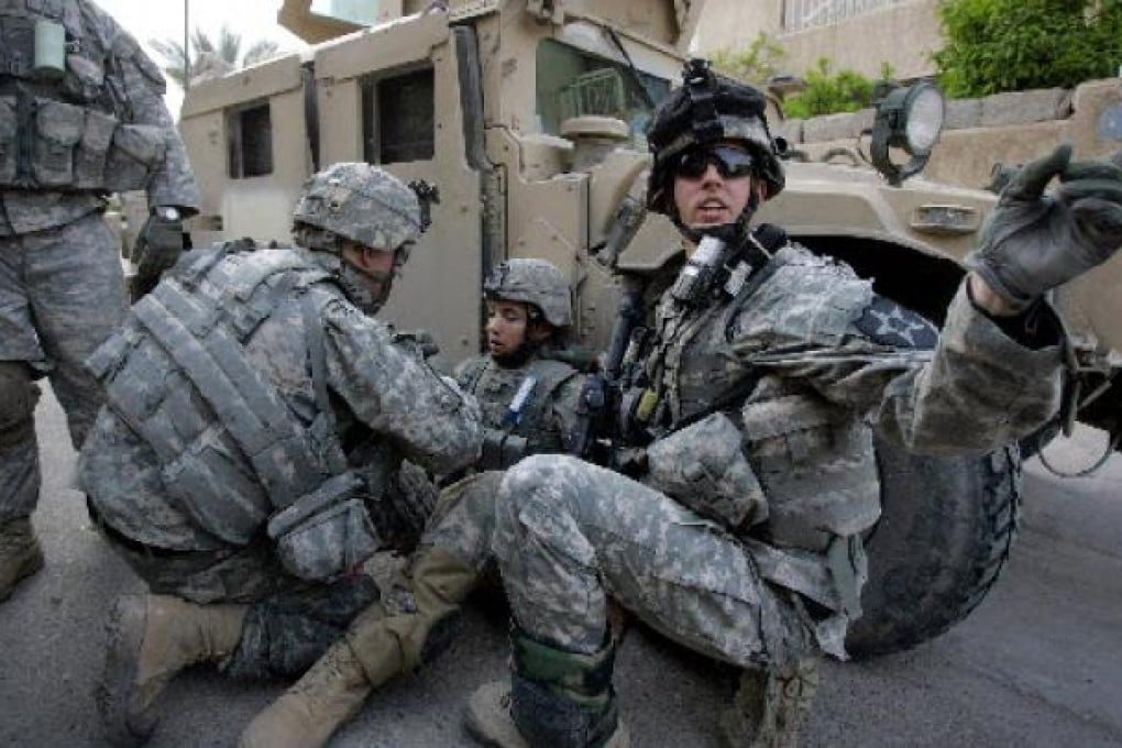 US troops attend to a wounded colleague during the Iraq war. This month marks the 10th anniversary of the US invasion of Iraq. Photo: AFP