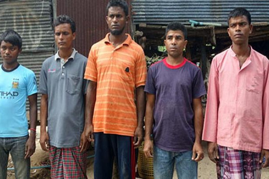 Rohingyan men who managed to swim to shore after Thai security forces opened fire on boatpeople off Phuket. Photo: Phuketwan