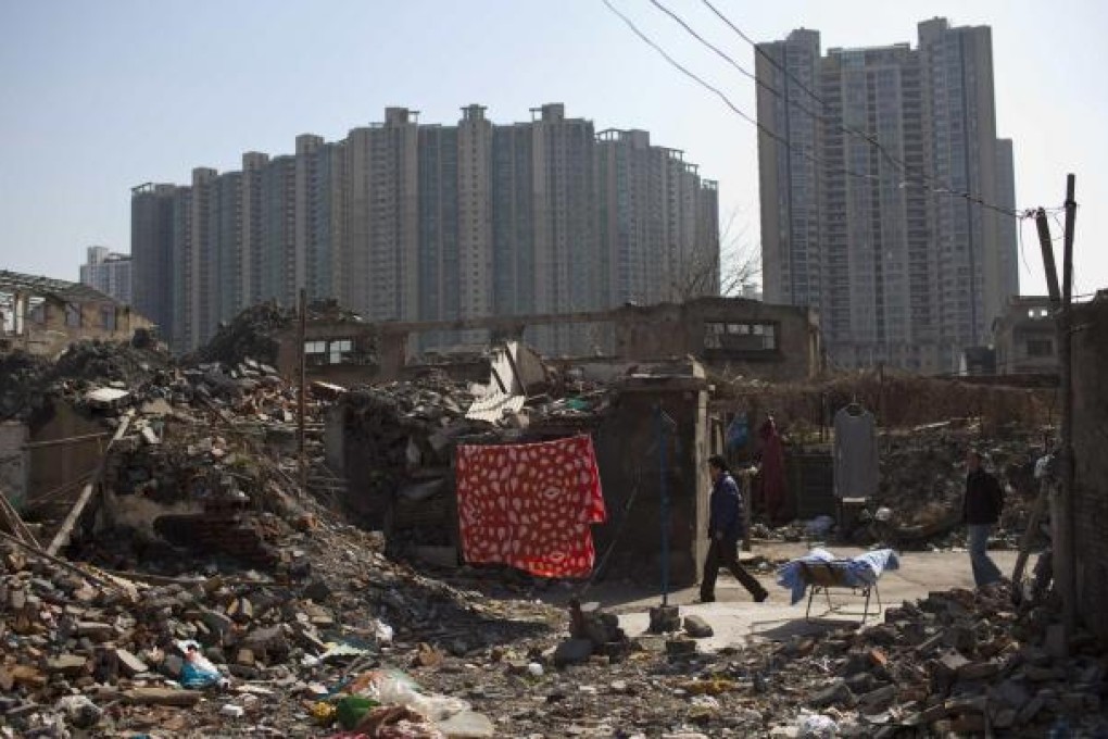 Urbanisation could case new poverty, said Li. Photo: Reuters