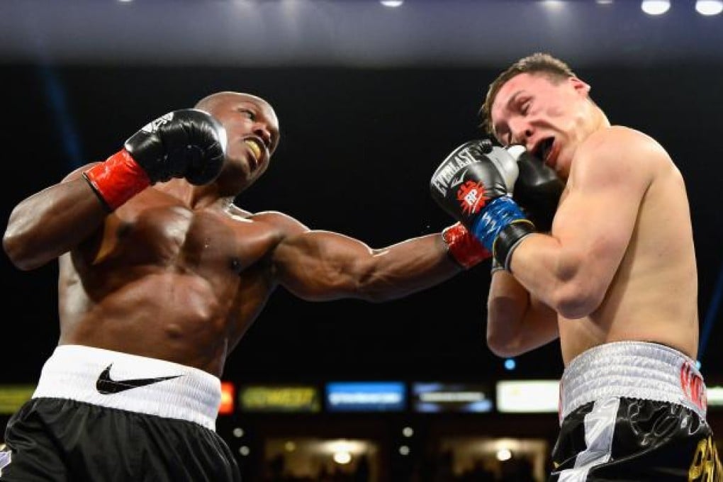 Timothy Bradley (left) lands a punch against his opponent Ruslan Provodnikov during their WBO Welterweight Championship fight on Saturday. Photo: AFP