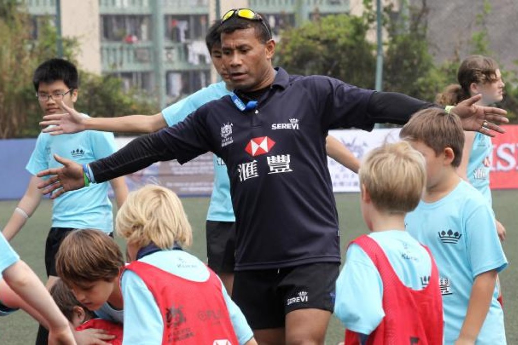 Fijian sevens star Waisale Serevi gives direction in a 'fun day' event at King's Park yesterday. Photo: Edward Wong