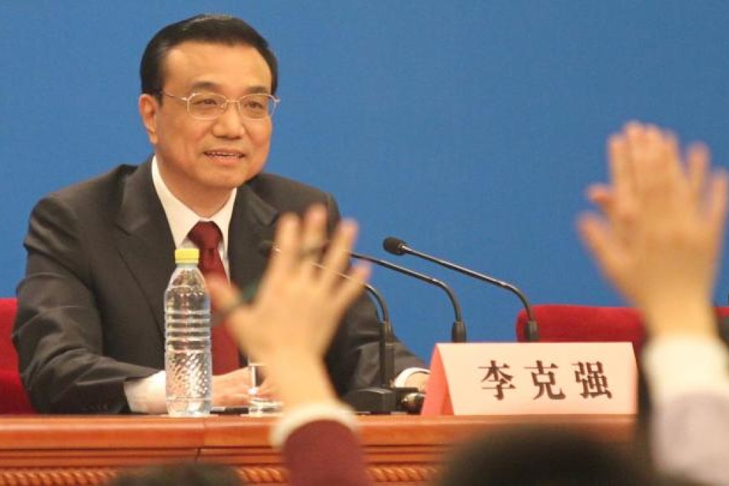 China's new Premier Li Keqiang answer's questions during the annual news conference following the closing session of the National People's Congress (NPC) on Sunday. Photo: Simon Song