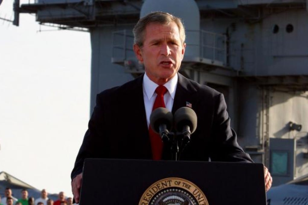George Bush declares "Mission Accomplished" in May 2003.