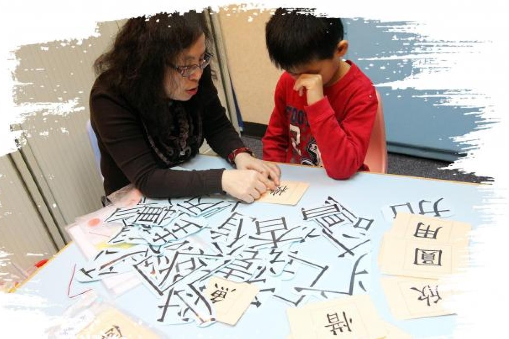 Wendy Leung teaches Alex Li at Uncle James Child Development Centre.Photo: David Wong