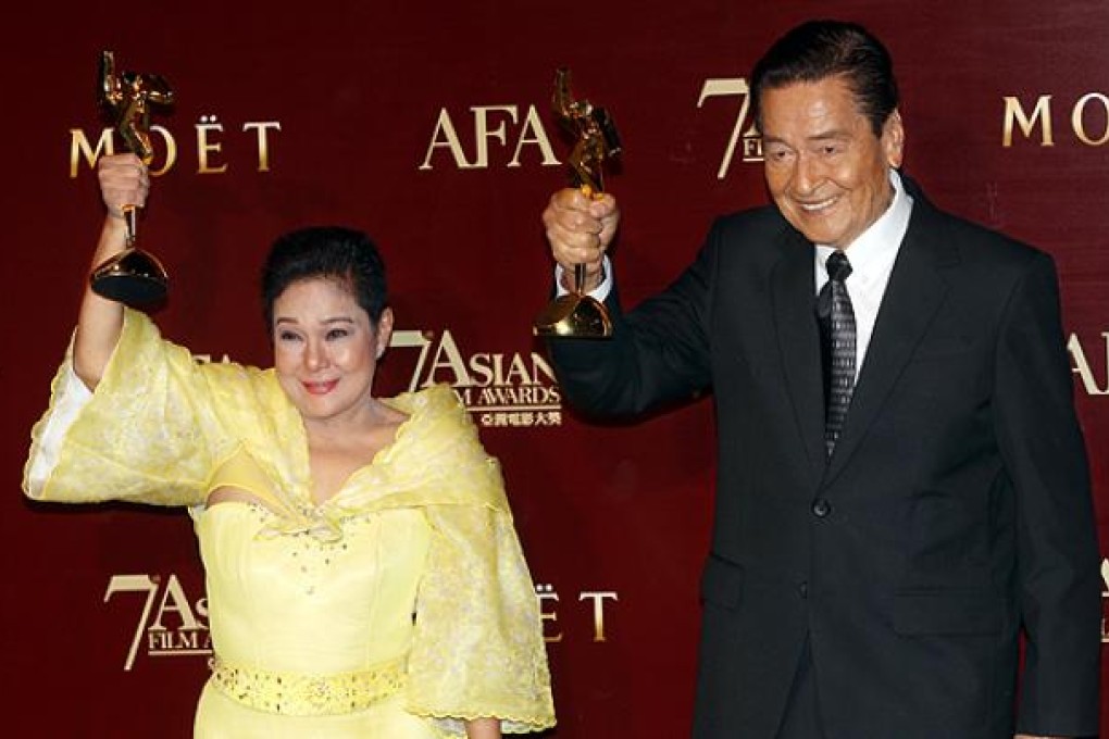 Philippines' Nora Aunor and Eddie Garcia pose with their trophies after winning the Best Actress and Best Actor Award at the Asian Film Awards. Photo: Sam Tsang