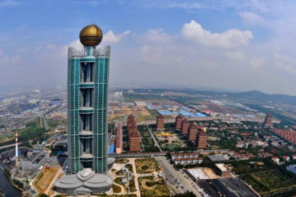 The Longxi International Hotel is 328 metres high and cost US$470 million to build in Huaxi village. Photo: AFP