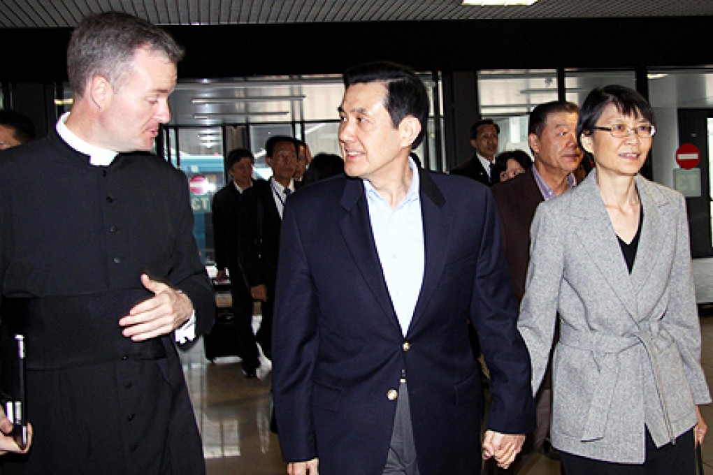 Taiwanese President Ma Ying-jeou (centre) and the first lady arrive at the airport in Rome. Photo: EPA