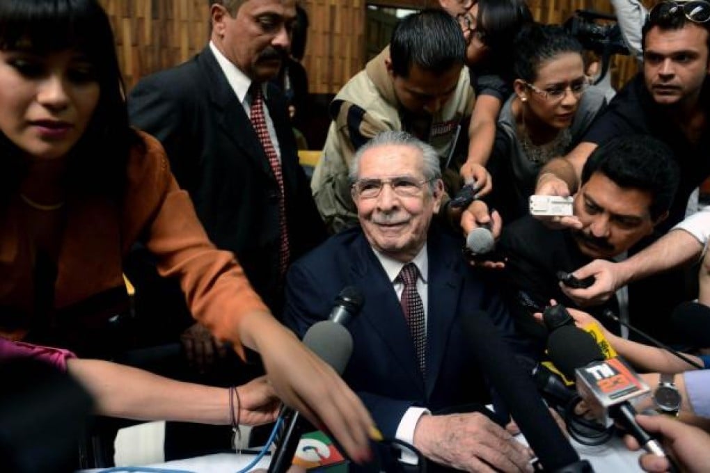 Former Guatemalan strongman Jose Efrain Rios Montt is besieged by journalists just before his genocide trial opens. Photo: AFP