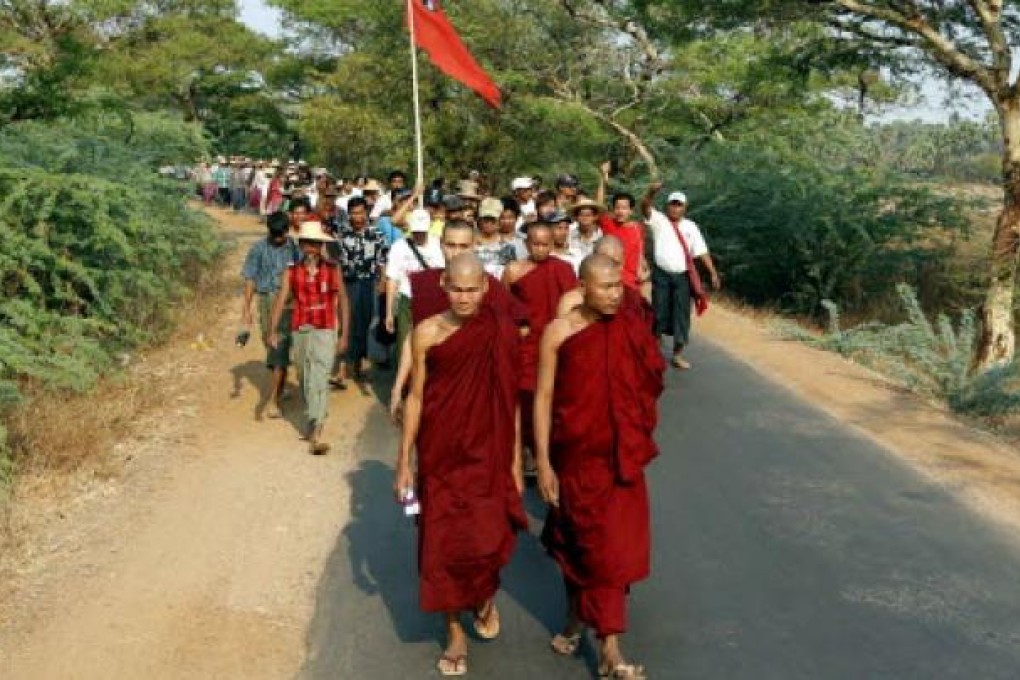 Buddhist monks and supporters in Myanmar. Two people including a Buddhist monk were killed and at least three mosques destroyed after rioting in central Myanmar, police confirmed on Thursday.