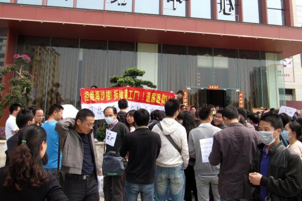 Owners protest at the use of untreated sea sand in building projects. Photo: SCMP