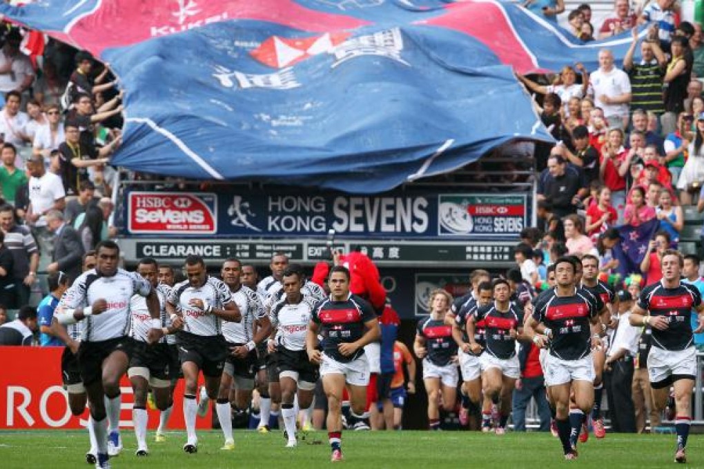 The Hong Kong team enter the stadium for their match against mighty Fiji yesterday. For the players, the jersey they wore is something they will treasure for the rest of their lives. Photo: Nora Tam