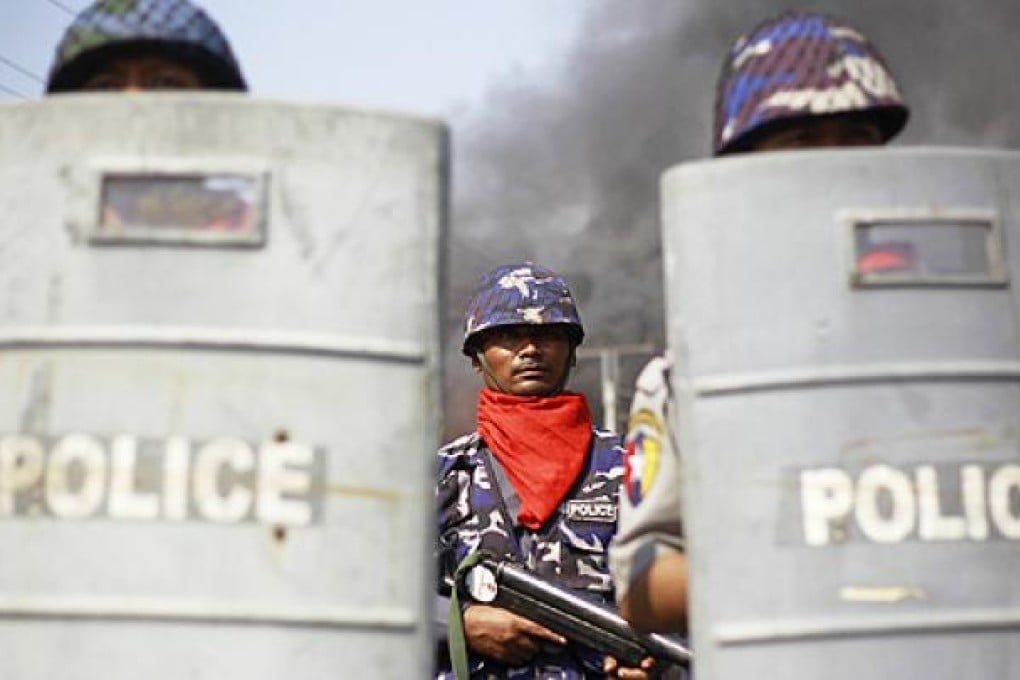 Policemen are deployed to provide security amid riots in Meikhtila on Friday. Photo: Reuters