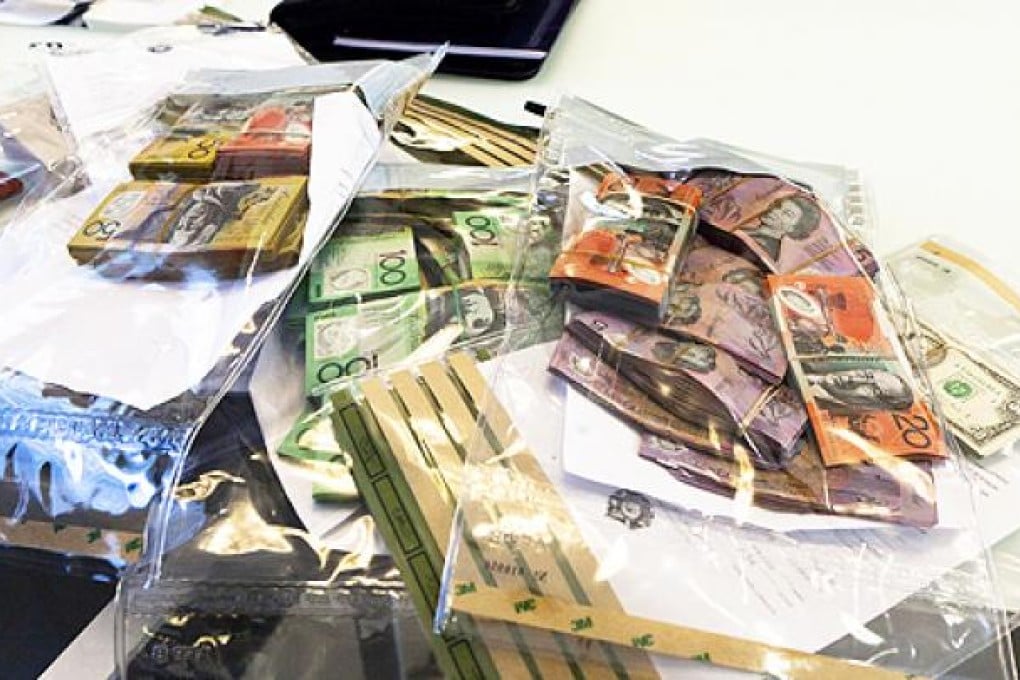 Some of the A$4 million cash confiscated by the Australian Federal Police. Photo: AFP