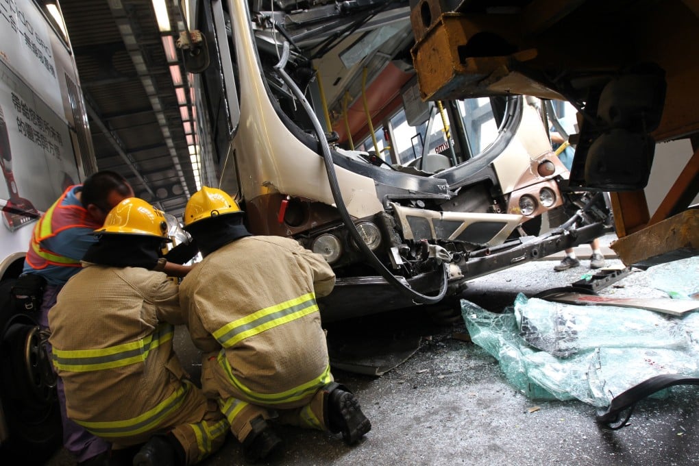 Emergency services inspect one of the buses. Photo: David Wong/SCMP